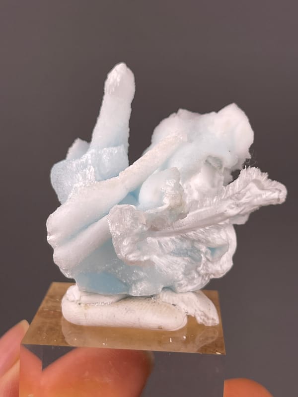 Blue Aragonite specimen from Yunnan, China featuring pale blue and white columns