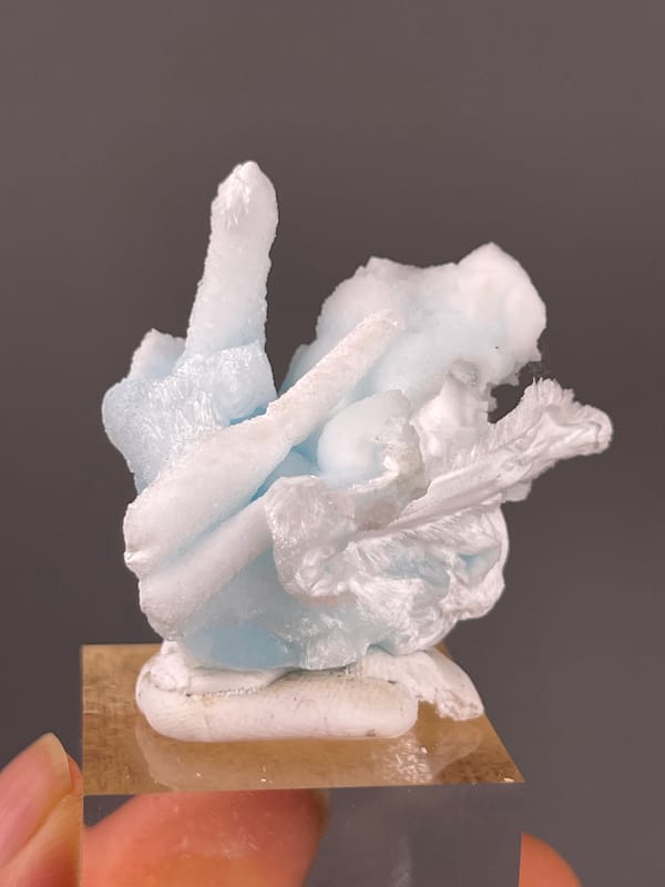 Blue Aragonite specimen from Yunnan, China showing pale blue and white columns
