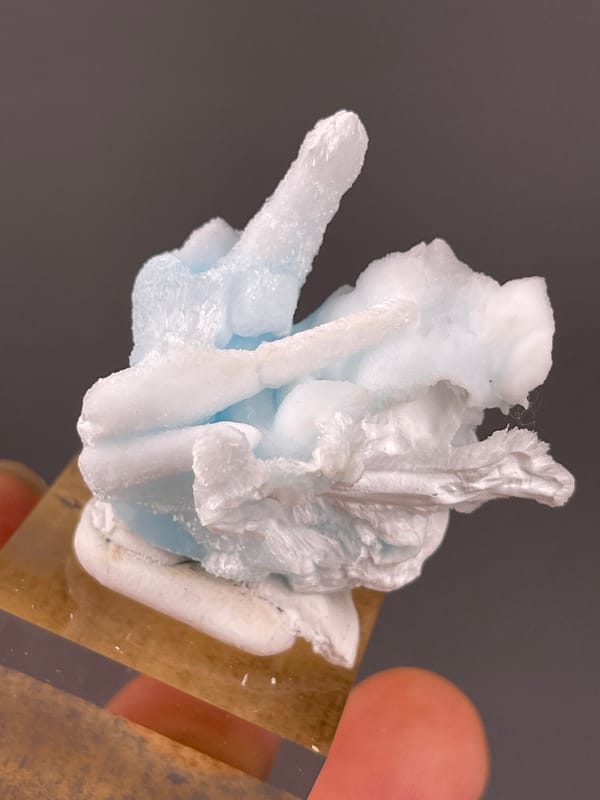 Blue Aragonite specimen from Yunnan, China highlighting pale blue and white columns