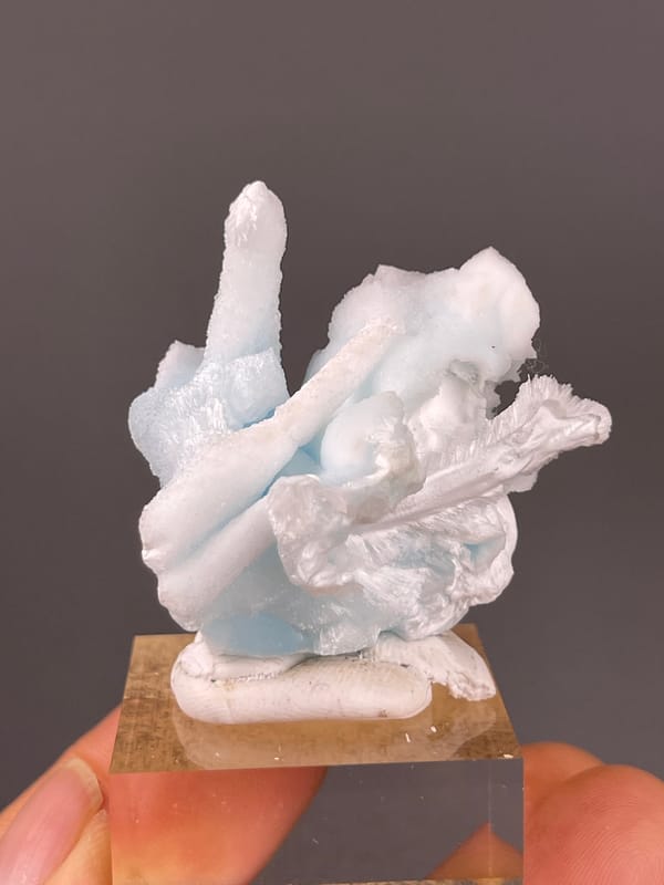 Blue Aragonite specimen from Yunnan, China bearing pale blue and white columns