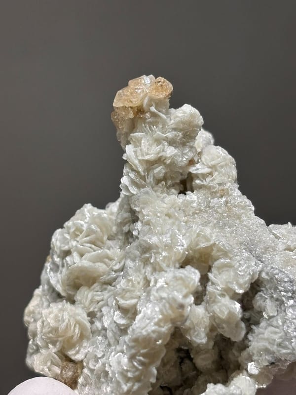 Cream scheelite and mica cluster with fluorite from Xuebaoding, Sichuan, China, view 5 of 7