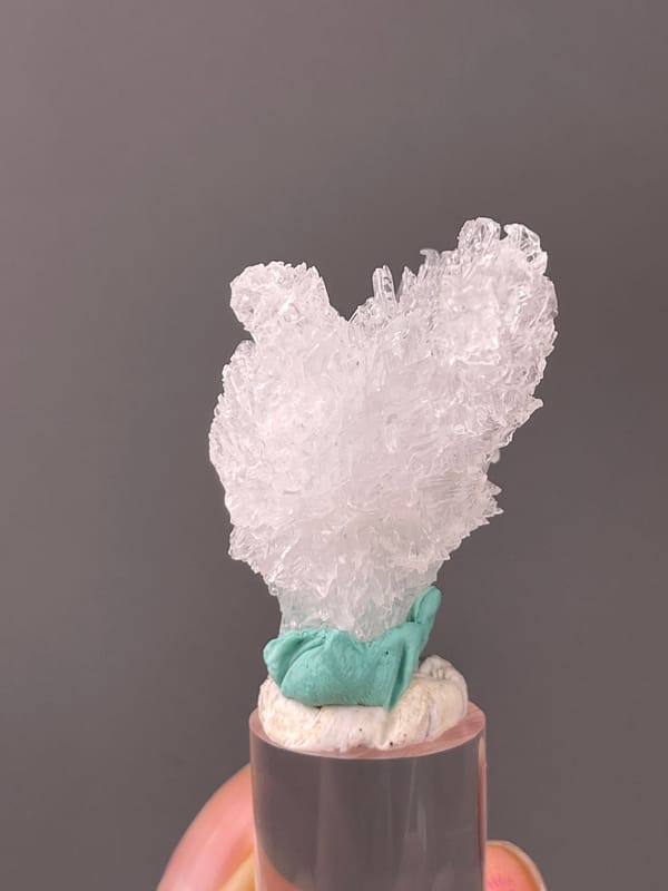 Creedite specimen from Qinglong, Guizhou, China highlighting colorless radiating prismatic cluster