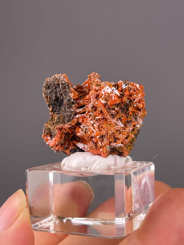 Orange-red lustrous blades on natural crocoite specimen from Australia