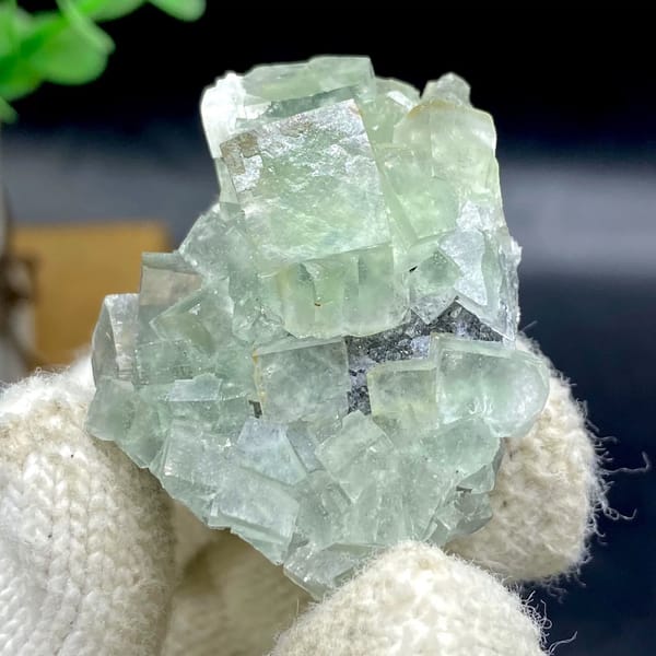 Pale green fluorite cubes with dark sulfide base from Hunan, China, view 2 of 9