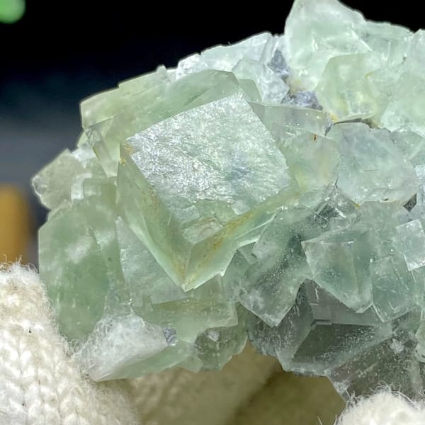 Pale green fluorite cubes with dark sulfide base from Hunan, China, view 3 of 9