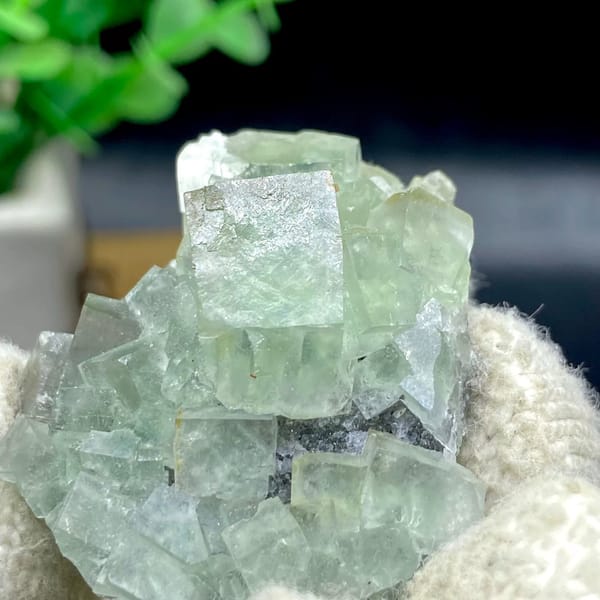 Pale green fluorite cubes with dark sulfide base from Hunan, China, view 4 of 9