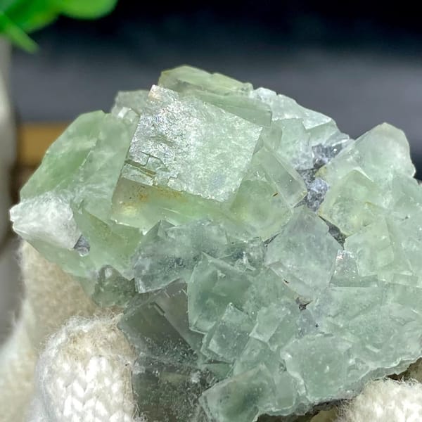 Pale green fluorite cubes with dark sulfide base from Hunan, China, view 5 of 9