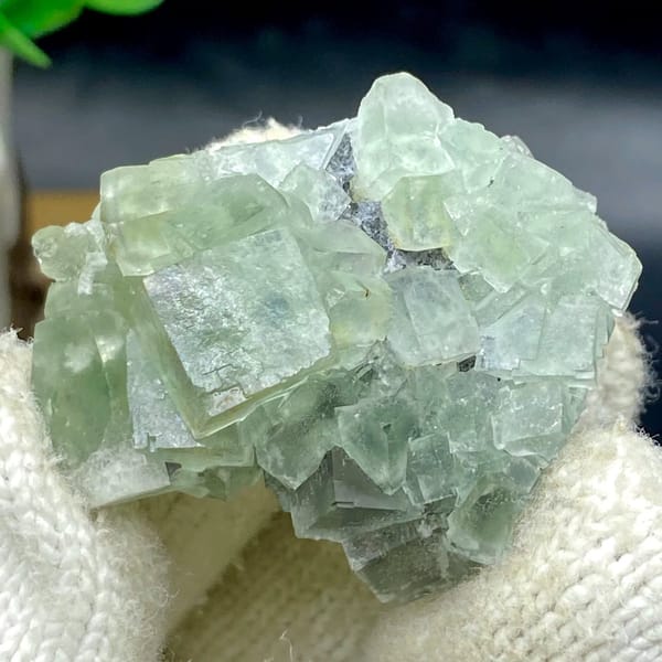 Pale green fluorite cubes with dark sulfide base from Hunan, China, view 6 of 9
