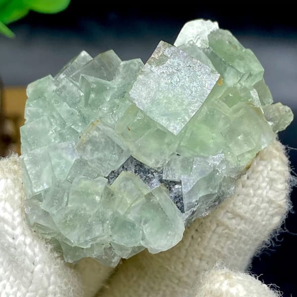 Pale green fluorite cubes with dark sulfide base from Hunan, China, view 8 of 9