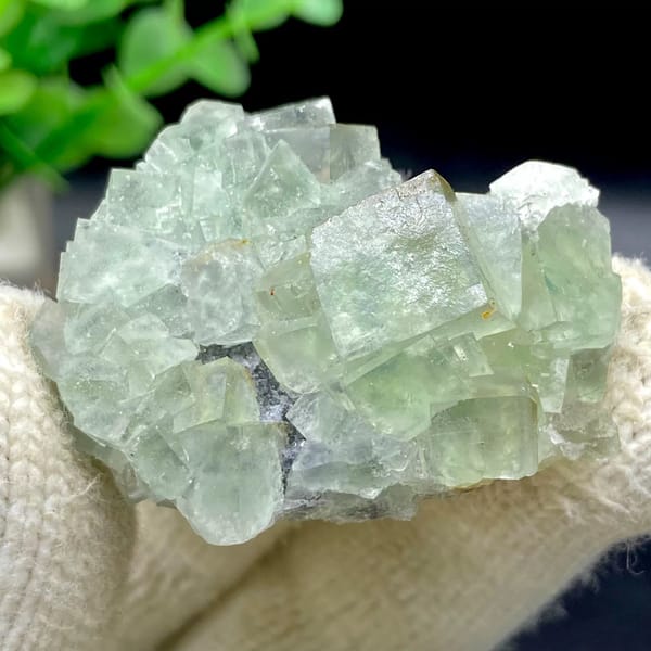 Pale green fluorite cubes with dark sulfide base from Hunan, China, view 9 of 9