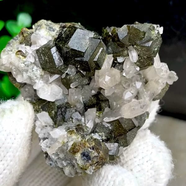 Dark green garnet dodecahedra on white quartz from Inner Mongolia, China