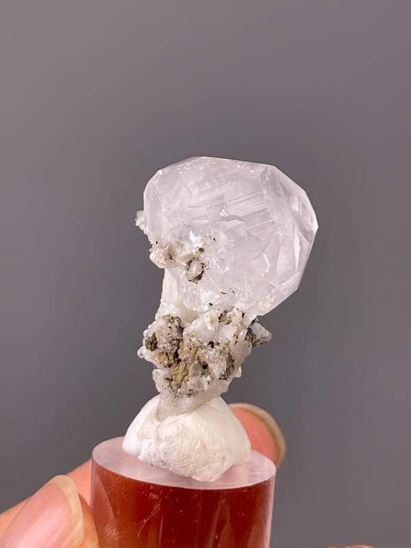 Colorless complex calcite crystal visible on calcite specimen from Hubei, China