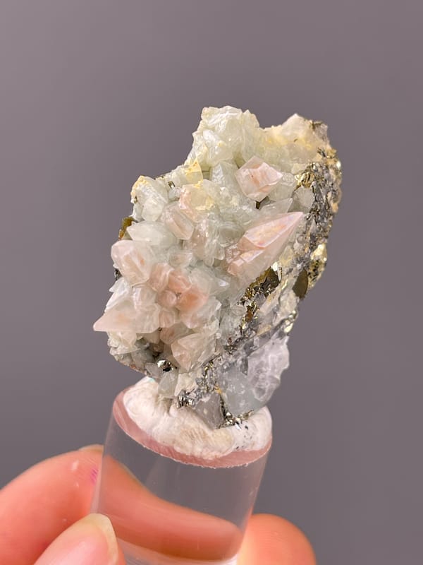 Pale green and pink calcite crystals visible on dogtooth calcite specimen from Daye, Hubei, China