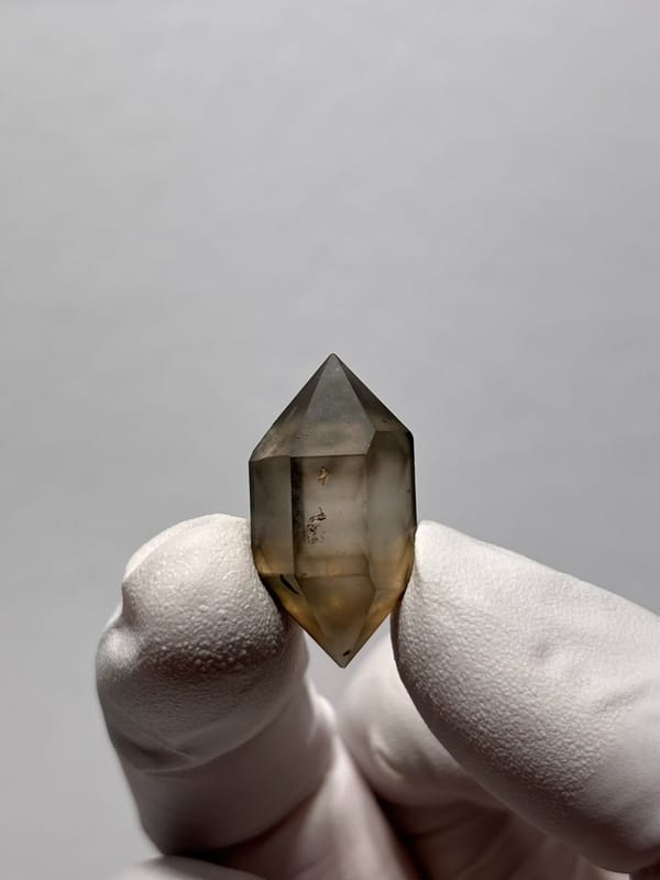 Tiny smoky double-terminated quartz with phantom from Yunnan, China, view 2 of 8