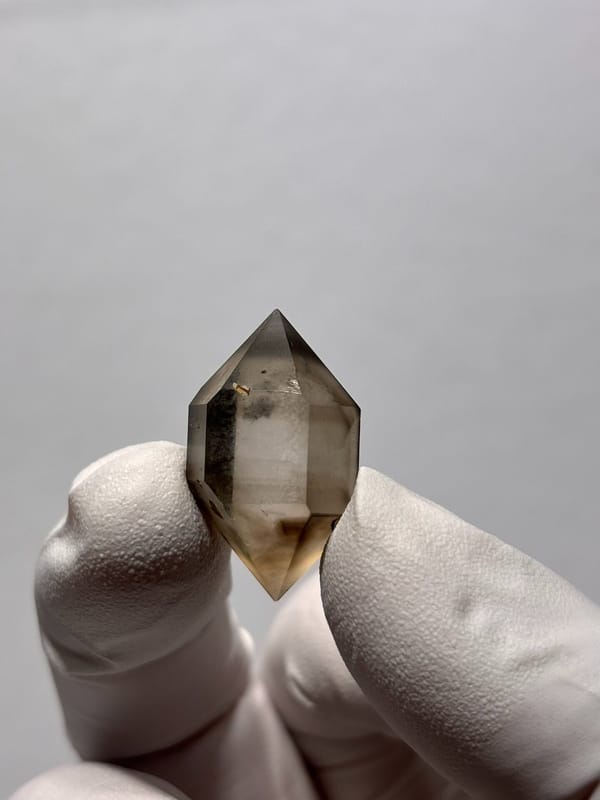Tiny smoky double-terminated quartz with phantom from Yunnan, China, view 4 of 8