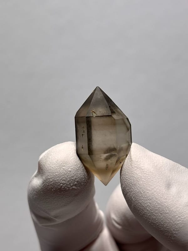 Tiny smoky double-terminated quartz with phantom from Yunnan, China, view 6 of 8