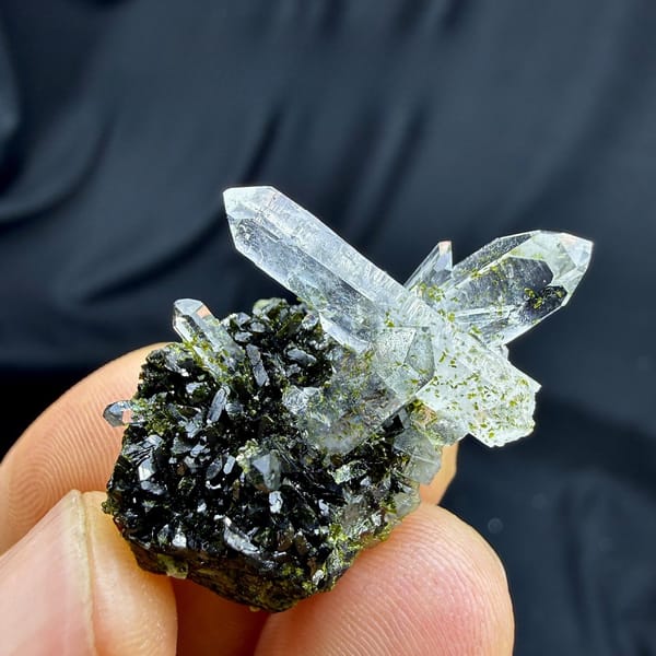 Clear quartz points on dark green epidote from Sichuan, China, view 6 of 6