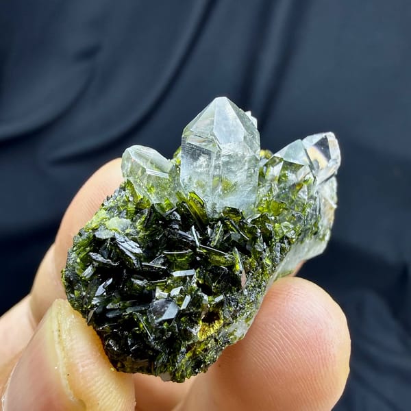 Transparent quartz points on dark green epidote from Sichuan, China, view 5 of 6