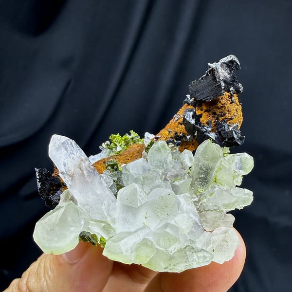 Clear quartz cluster with black babingtonite and epidote from Sichuan, China, view 2 of 6