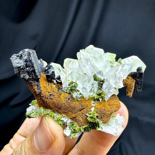 Clear quartz cluster with black babingtonite and epidote from Sichuan, China, view 4 of 6