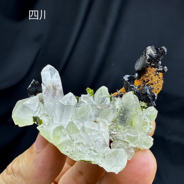 Clear quartz cluster with black babingtonite and epidote from Sichuan, China, view 6 of 6