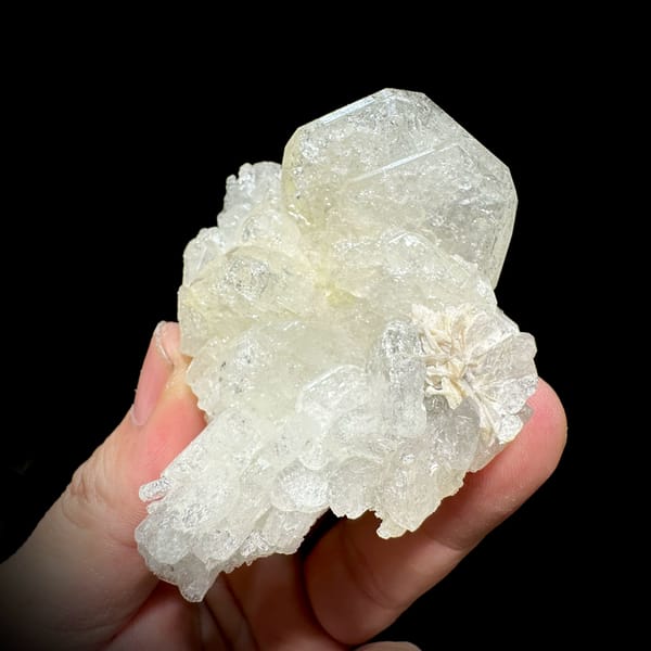 Etched hollowed aquamarine crystal with mica and scheelite from Xuebaoding, Sichuan, China, top view