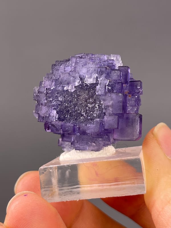 Etched Stepped Purple Fluorite specimen from Xinjiang, China showing etched stepped purple cubes