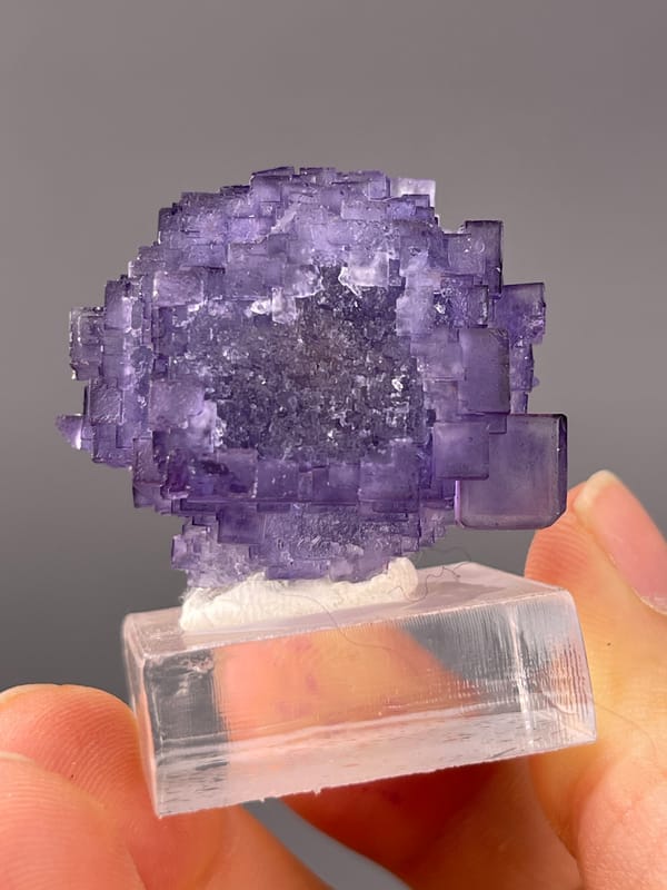 Etched Stepped Purple Fluorite specimen from Xinjiang, China, defined by etched stepped purple cubes