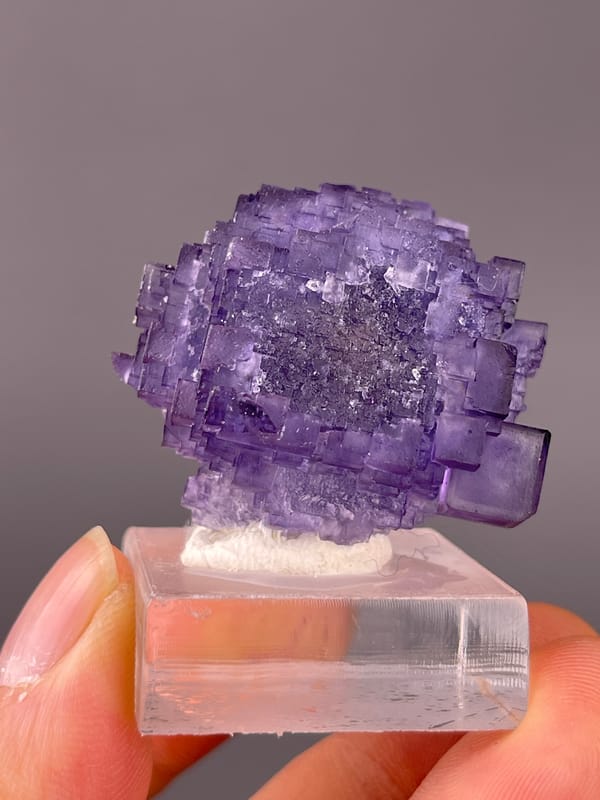 Etched Stepped Purple Fluorite specimen from Xinjiang, China presenting etched stepped purple cubes
