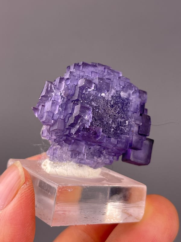 Etched stepped purple cubes visible on etched stepped purple fluorite specimen from Xinjiang, China