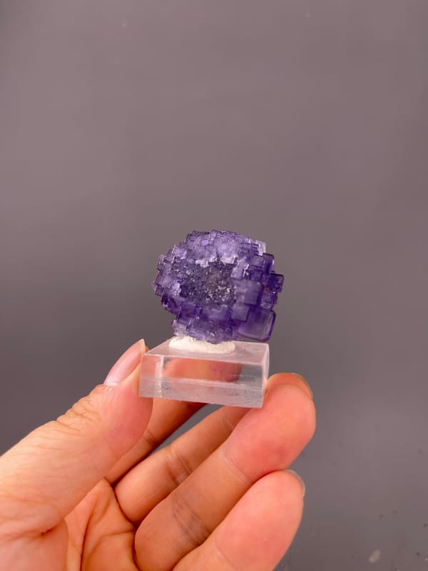Etched Stepped Purple Fluorite specimen from Xinjiang, China bearing etched stepped purple cubes