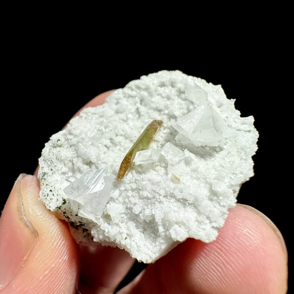 Single olive titanite blade on white feldspar druse from Pakistan, view 2 of 6