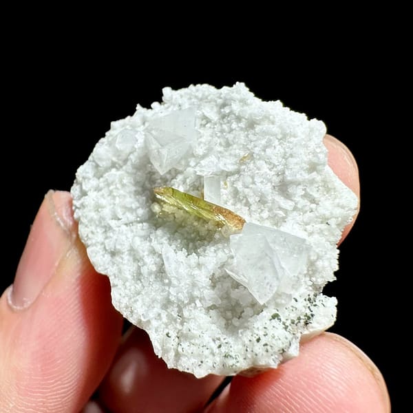 Single olive titanite blade on white feldspar druse from Pakistan, view 4 of 6