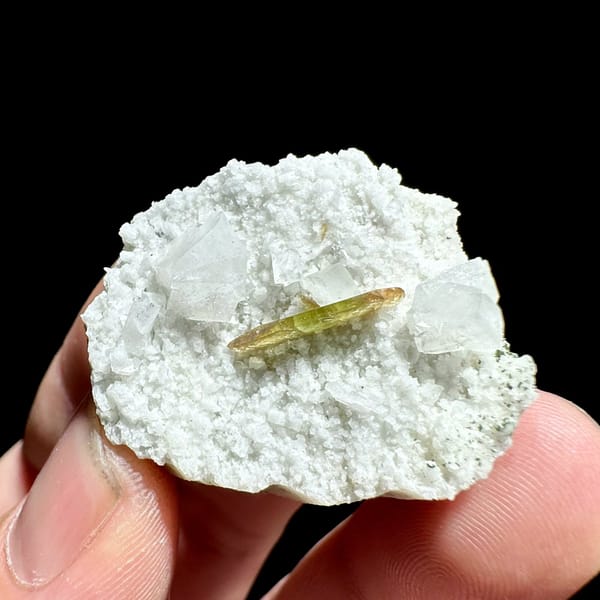 Single olive titanite blade on white feldspar druse from Pakistan, view 5 of 6