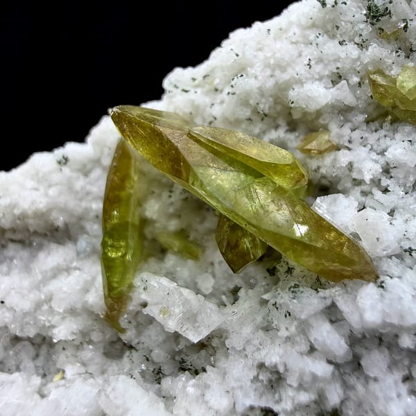 Yellow-green titanite blades on white feldspar plate from Pakistan, view 4 of 6