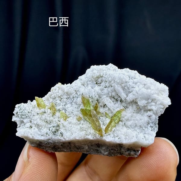 Yellow-green titanite blades on white feldspar plate from Pakistan, view 6 of 6