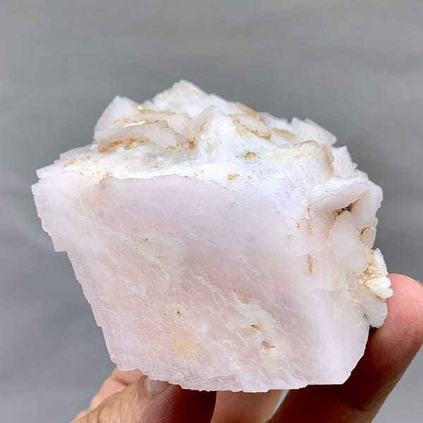Pale pink kutnohorite with brassy pyrite cluster from Peru, view 4 of 6