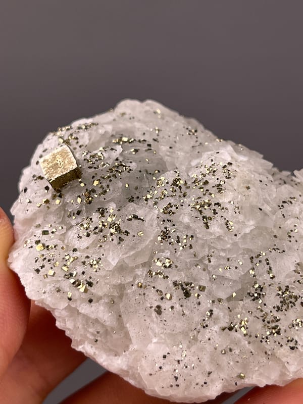 Fluorescent Petal-form Calcite specimen from Longyan, Fujian, China, defined by white petal-form druse with pyrite