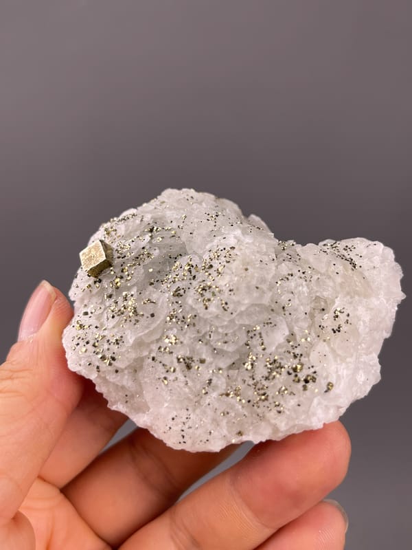 White petal-form druse with pyrite visible on fluorescent petal-form calcite specimen from Longyan, Fujian, China