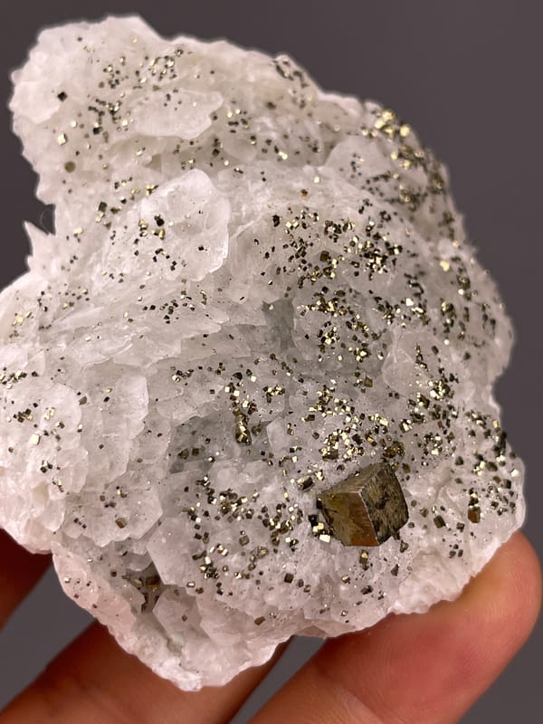 White petal-form druse with pyrite on natural fluorescent petal-form calcite specimen from Longyan, Fujian, China
