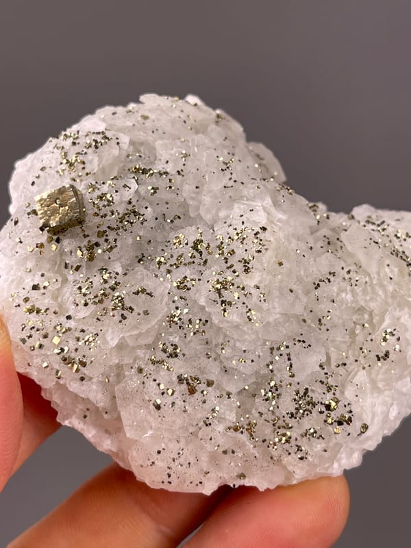 Fluorescent Petal-form Calcite specimen from Longyan, Fujian, China, characterized by white petal-form druse with pyrite