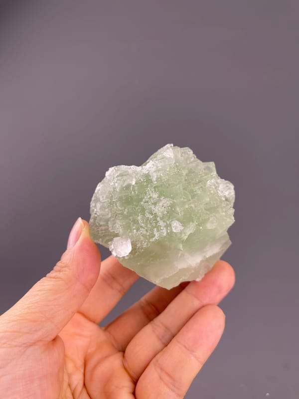 Fluorite from Fujian, China: pale green stepped crystal surface.