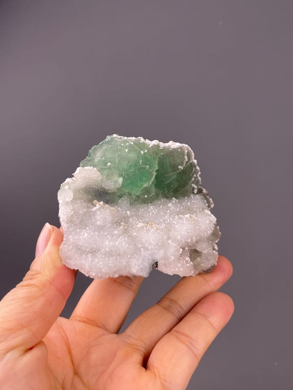 Fluorite from Fujian, China: pale green faces bordering white sugary quartz.