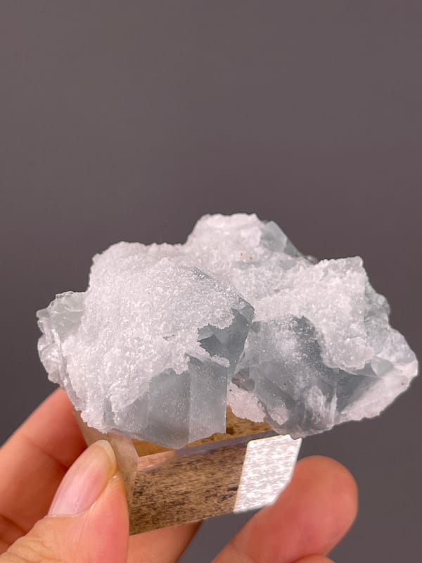 Fluorite from Fujian, China: white quartz coating along the upper edge.
