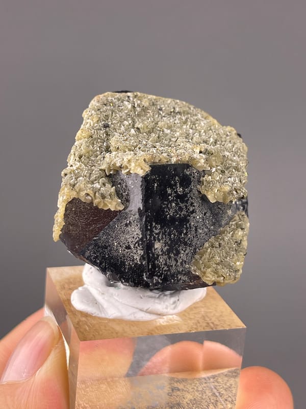 Fluorite from Fujian, China: reverse angle showing a large dark reflective face.