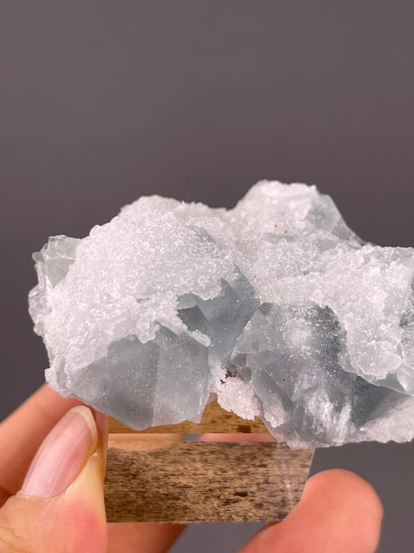 Fluorite from Fujian, China: close view of the white crystalline coating.