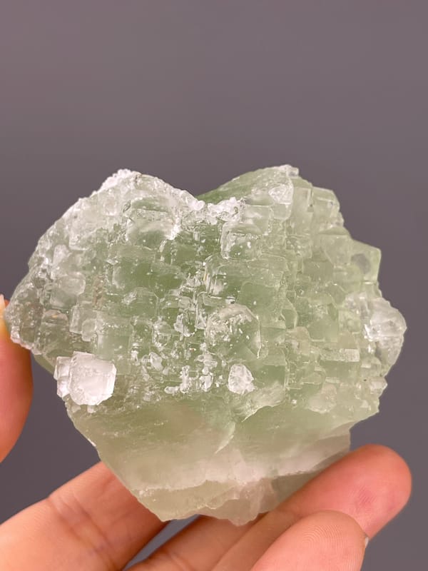 Fluorite from Fujian, China: front face with scattered white patches.