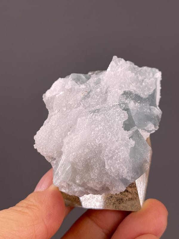 Fluorite from Fujian, China: reverse side covered in fine white quartz.