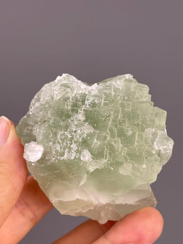 Fluorite from Fujian, China: pale lower margin beneath green stepped faces.