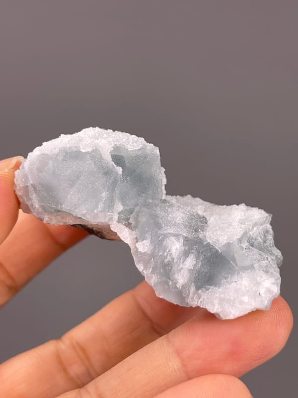 Fluorite from Fujian, China: side profile with granular white coating.